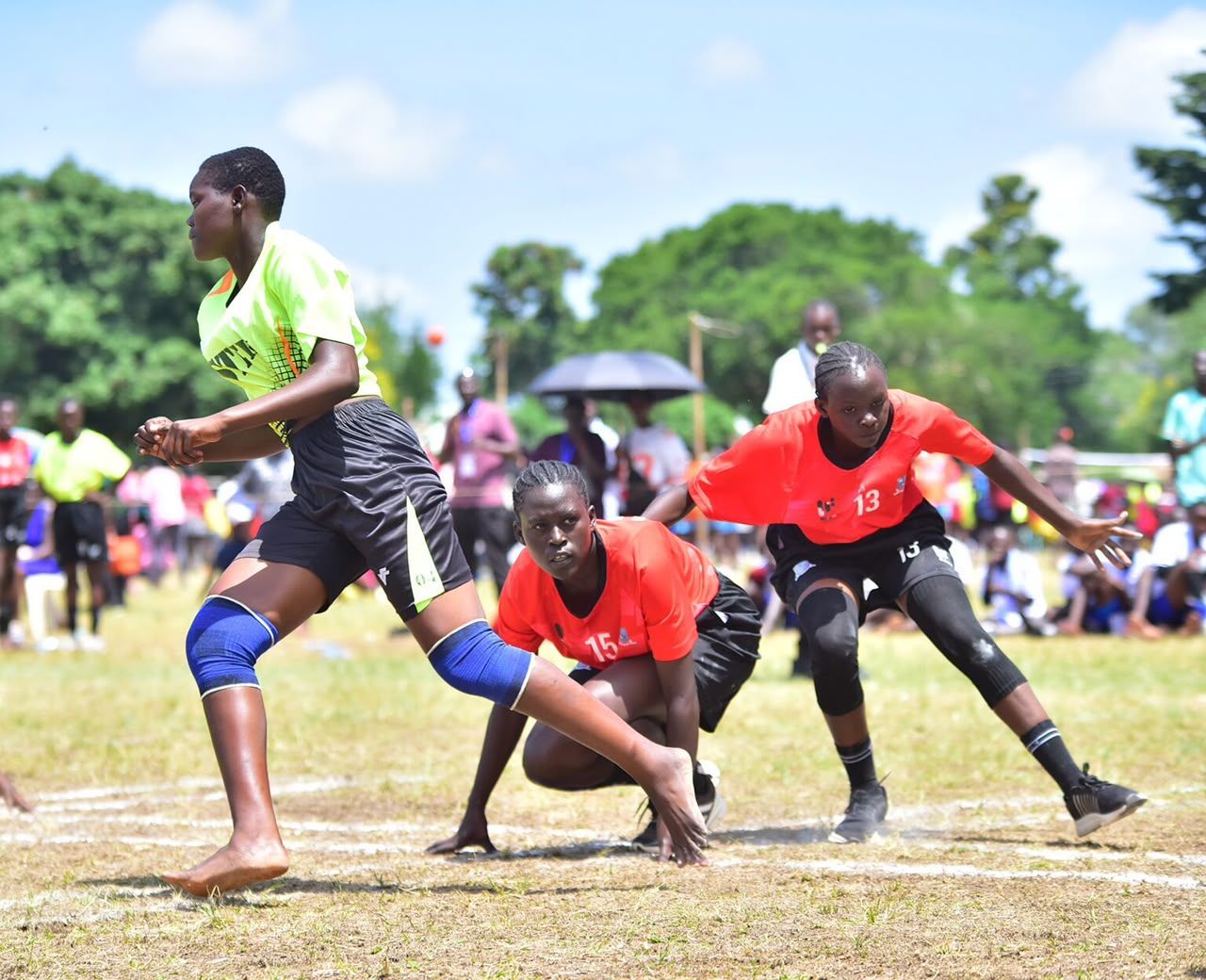 Players chase and defend during a schools Kho Kho match
