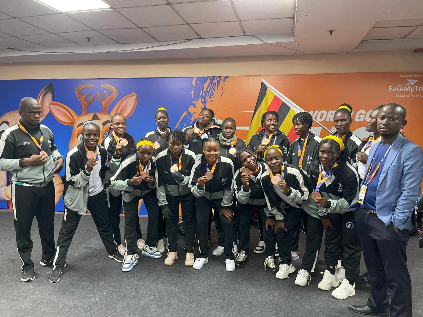 Uganda's women display their bronze medals at the Kho Kho World Cup