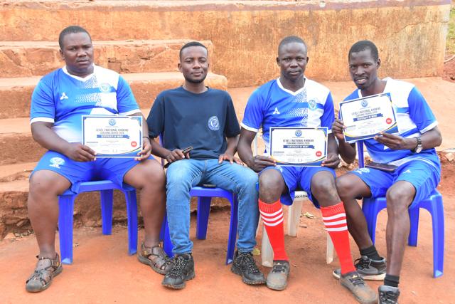 Four participants with their certificates