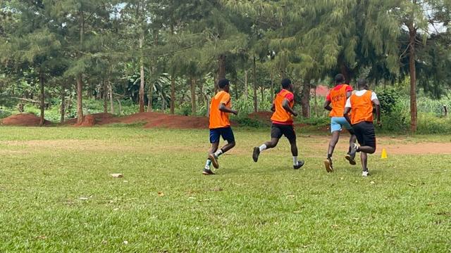 Players in orange bibs during a practical session