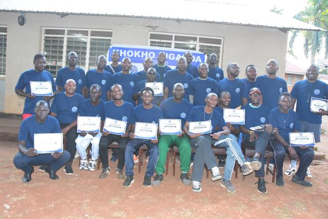 A large group of participants with their certificates