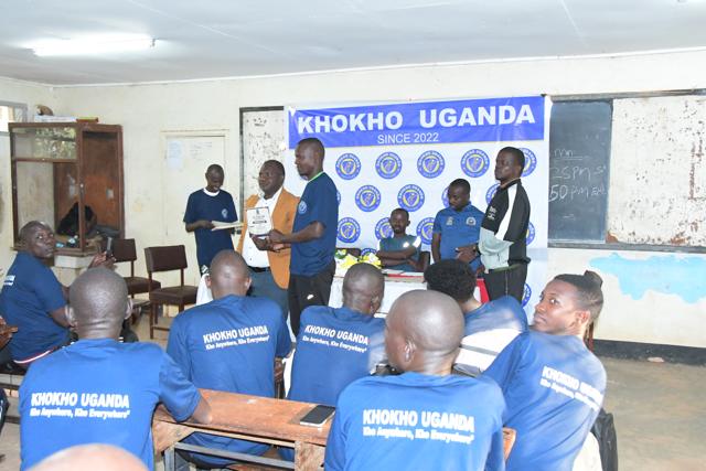 Participants gather at the banner