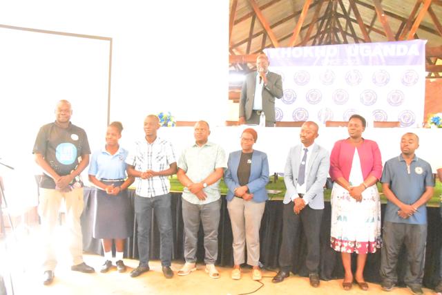 Guests and participants stand together