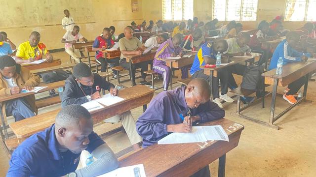 Participants writing at their desks