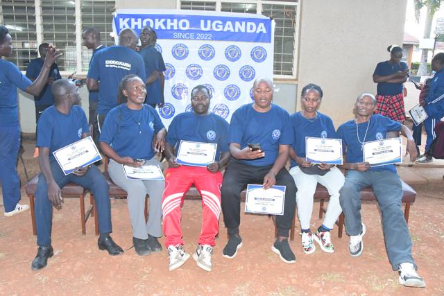 Participants seated with certificates