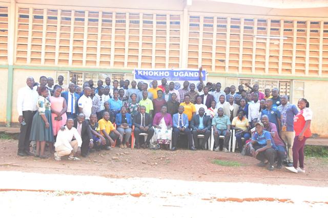 A full group photo outside the hall