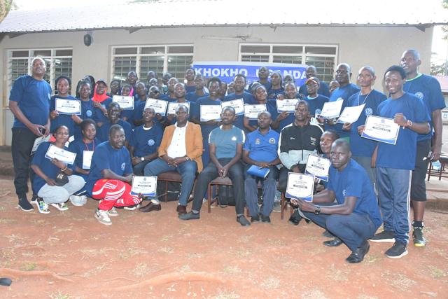 Participants with certificates after the ceremony