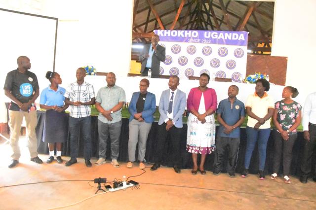 Guests and participants stand together