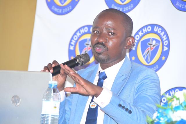 A speaker addresses the participants