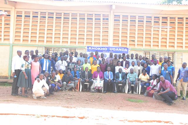 A full group photo outside the hall